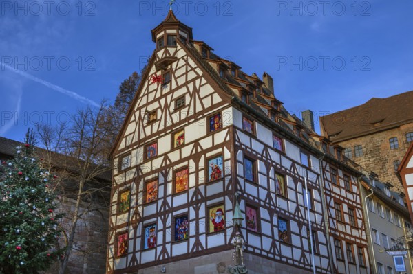Historic Pilate House with Advent Calendar in the Evening Sun, Beim Tiergärtnertor, Nuremberg,