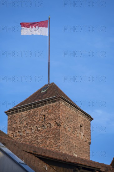 Waving Frankish flag on the Kaiserburg tower, Nuremberg, Middle Franconia, Bavaria, Germany
