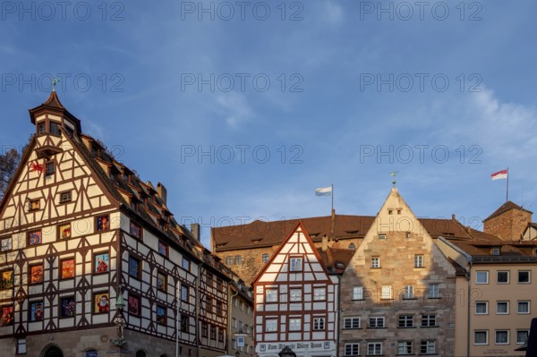 Historic Pilate House with Advent calendar, historical residential buildings on the right and the