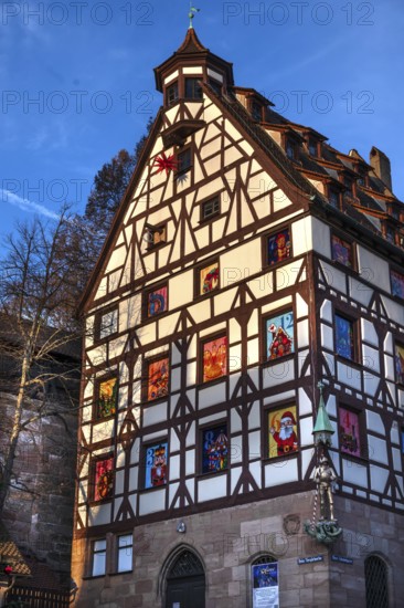 Historic Pilate House with Advent Calendar in the Evening Sun, Beim Tiergärtnertor, Nuremberg,