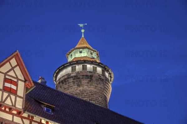 Sinwell Tower built in the 13th century, on the Nuremberg Kaiserburg in the evening lighting, blue