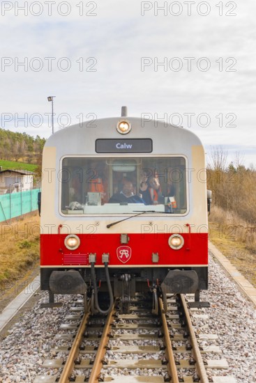 Front view of a train on the rails, with the inscription 'Calw', historical event, first test run