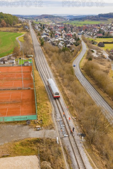 Overview of train travel along tennis courts on the outskirts of the city, historical event, first