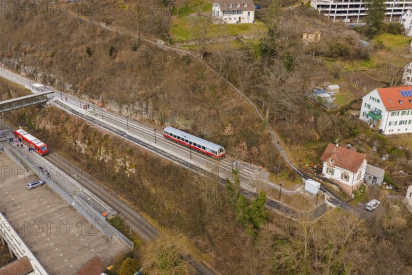 Zug moves through a varied landscape of hills and buildings in a wintry atmosphere, historic event,
