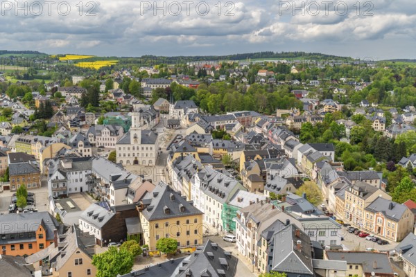 View from St. Wolfgang church of the town of Schneeberg with historic houses and town hall, Ore