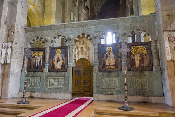 Altar of a church with impressive icons and wall paintings, Svetitskhoveli Cathedral,