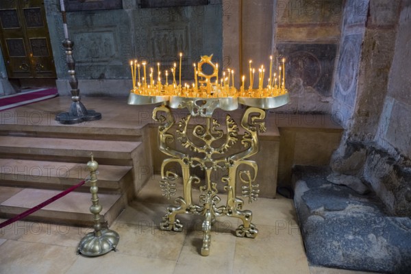 Bronze candle holder on an altar giving a church a solemn atmosphere, Svetitskhoveli Cathedral,
