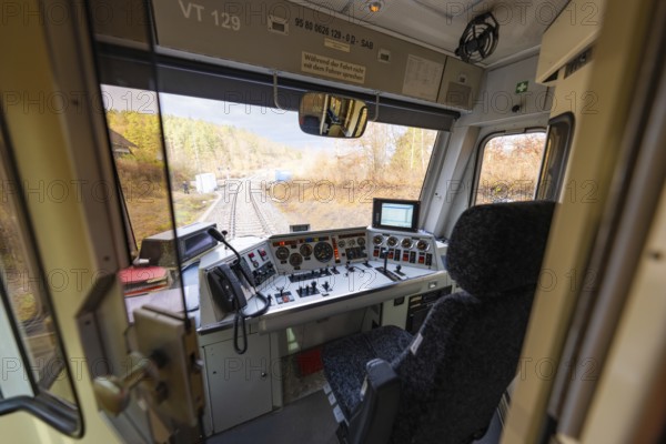 Driver's cab of a train with a view of the rails, technical instruments and control elements