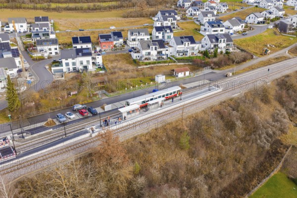 New residential development next to railway tracks in winter surroundings, historic event, first