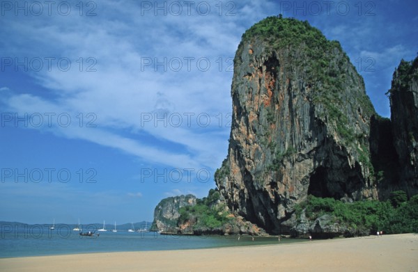 Rocks and boats on Pranang Cave beach, two years in front of the tsunami, Krabi, Thailand, December