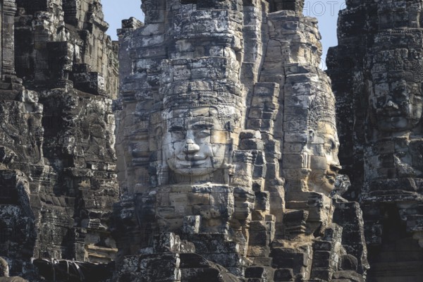 Huge stone-carved faces of Bodhisattva Lokeshvara, also Avalokiteshvara, Bayon Temple, Angkor Thom,