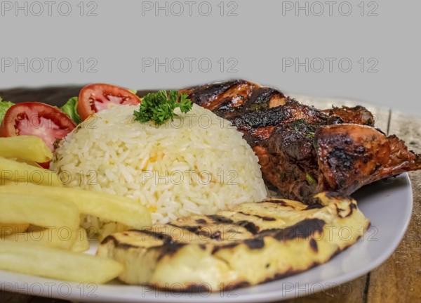 Pork rib with rice, fried cheese and salad served on the table, Close up of Pork rib with salad and