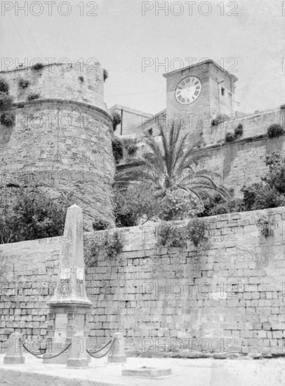 Lascaris clock tower and fortress defensive walls of the Citadel, Victoria, Island of Gozo, Malta,