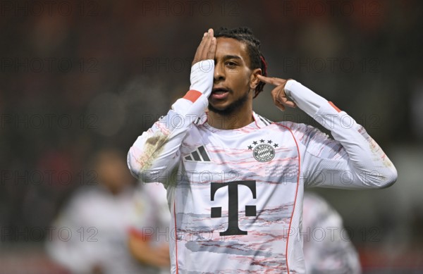 Goal celebration gesture Michael Olise FC Bayern Munich FCB (17) after surviving eye surgery, eye