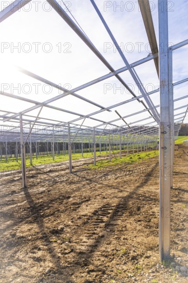 Metal framework for solar system installation shows solar radiation, energy revolution,