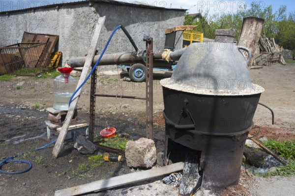Handmade distillation plant with metal container, liquor production, Sameba, Kvemo Kartli region,