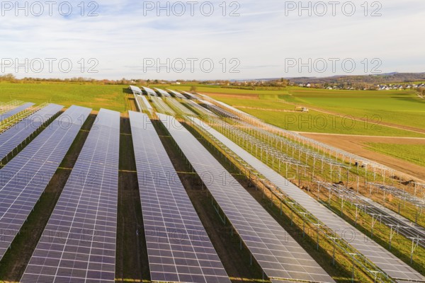 Wide solar fields spanning the hilly landscape, energy revolution, construction of PV open space,