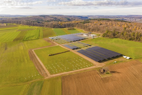 Extensive solar systems in a green and brown landscape, energy revolution, construction of PV open