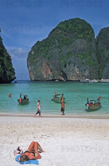 People, longtail boats on Maya Bay beach, known from the movie The Beach, one year in front of the