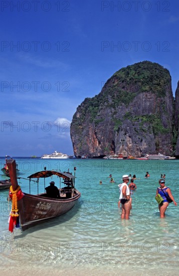 People, longtail boat on Maya Bay beach, known from the movie The Beach, one year in front of the