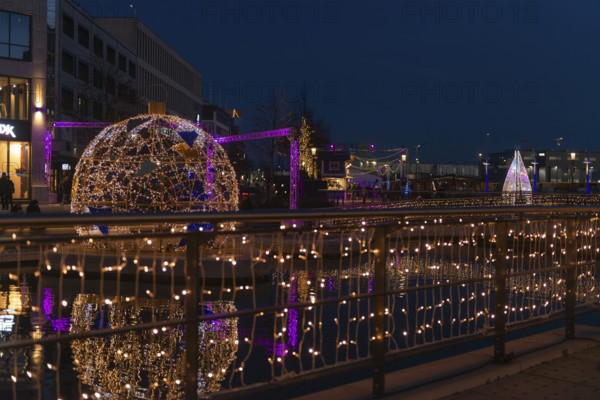 Christmas decoration in Kiel at the boat harbor, festive lighting, lights, Christmas ball, shops,