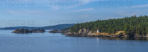 Passengers traveling by ferry from vancouver to victoria, british columbia, enjoying scenic views