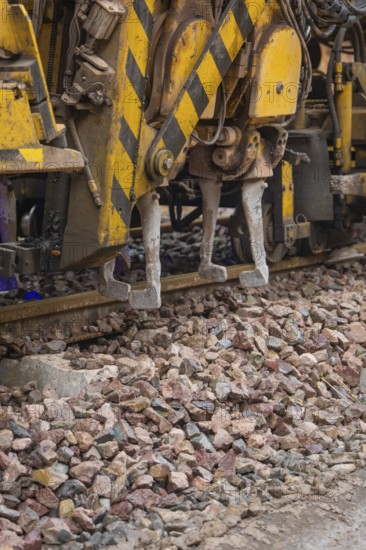 Close up of a construction machine used for track work on gravel, tamping machine on Hermann,