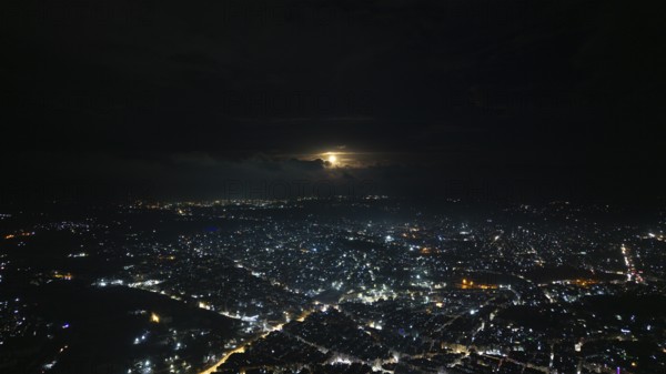 A Drone night view of Aleppo, Syria on December 19, 2025, showing illuminated streets, dense
