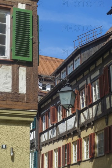Typical old town scene, half-timbered houses, old street lamp, light, shutters, idyll, Tübingen,