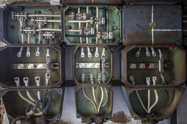 Old power box, dilapidated plant of a former agricultural production cooperative of the former GDR,