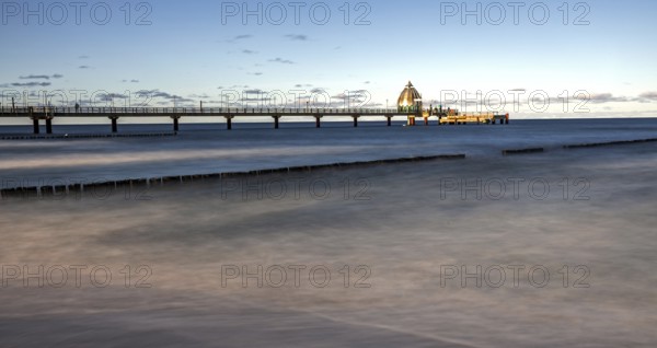 Groes and pier with diving gondola, panorama, long exposure, evening light, Zingst,