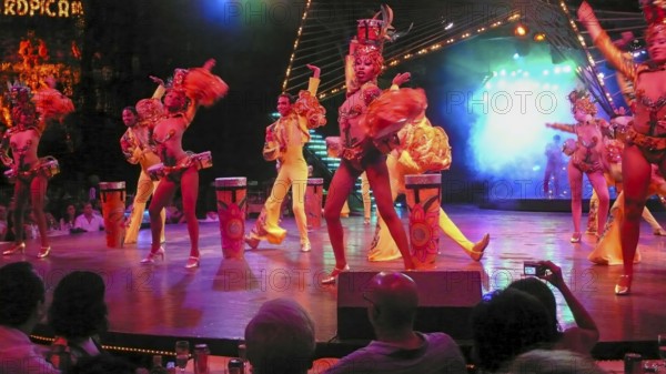Revue dancers in opulent colorful costume and with feather headdress at Club Tropicana, Havana,