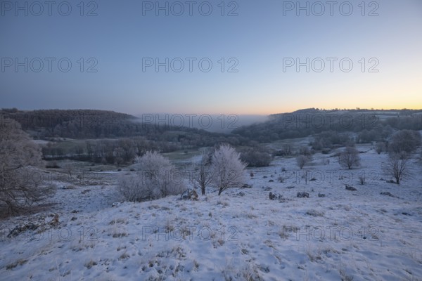 An impressive winter landscape on Randecker Maar near Ochsenwang, where a mystical sea of fog