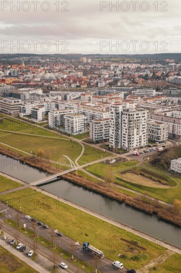 Large residential complex with modern buildings on a canal and adjacent green spaces, Böblingen,