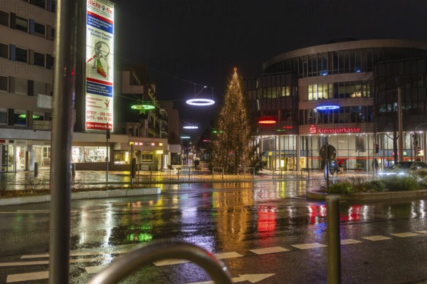 Illuminated Christmas tree and colorful street lights in the city at night, Böblingen Christmas