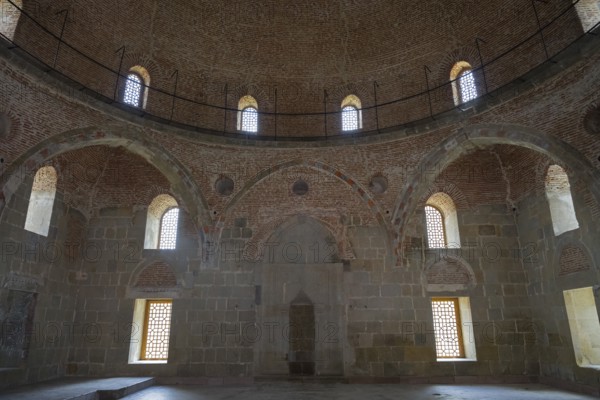 Historic interior with brick dome and windows that diffuse soft light into the room, Rabati