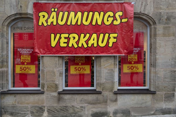 Posters for clearance sale at a shoe store, Lauf an der Pegnitz, Middle Franconia, Bavaria, Germany