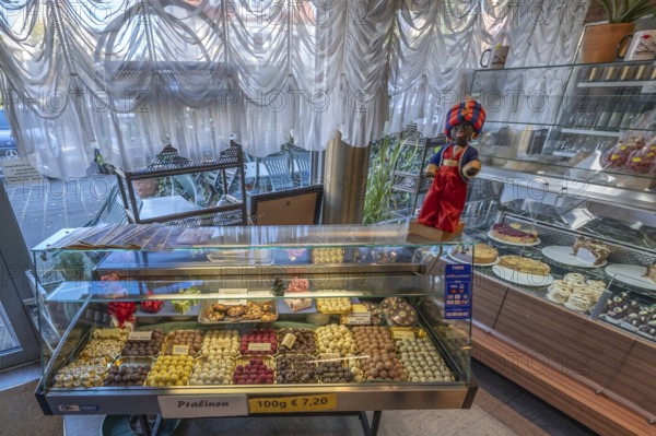 Showcases with homemade chocolates and cakes on the display case the trademark of the Sarotti