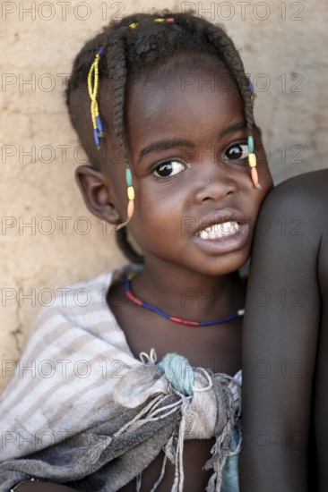 Portrait, brightly decorated girl of the Hakaona tribe, also Havakona or Hakawona, near Opuwo,