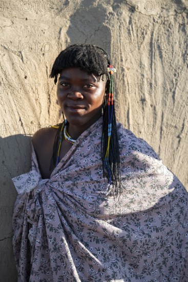 Portrait, brightly decorated woman of the Hakaona tribe, also Havakona or Hakawona, near Opuwo,