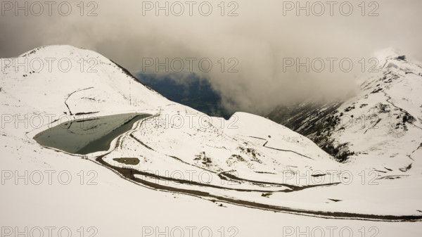 Another onset of winter in May, Riezler Alpsee, an artificially created lake, snow pond, feeds the
