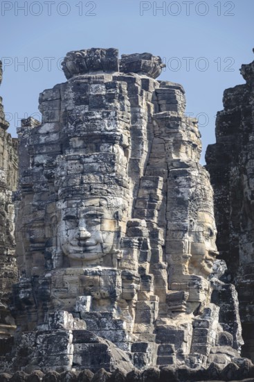 Huge stone-carved faces of Bodhisattva Lokeshvara, also Avalokiteshvara, Bayon Temple, Angkor Thom,