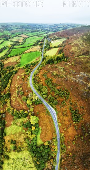 Autumn colours of Farms over River Wye and Road A470 from a drone, Llanidloes, Powys,