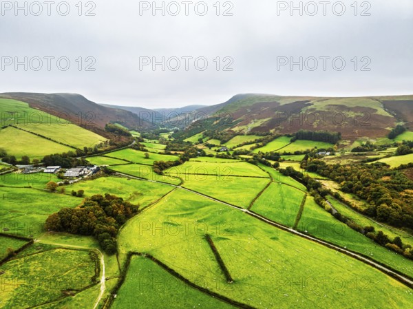 Autumn colours of Farms over River Wye and Road A470 from a drone, Llanidloes, Powys,