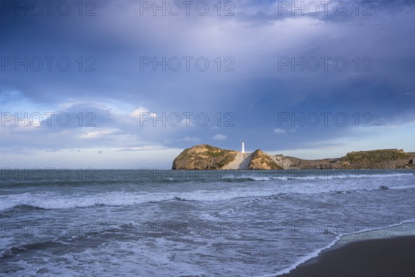Castlepoint Beach, ocean and lighthouse on a rock. Castlepoint, Wairarapa Coast, Wellington Region,