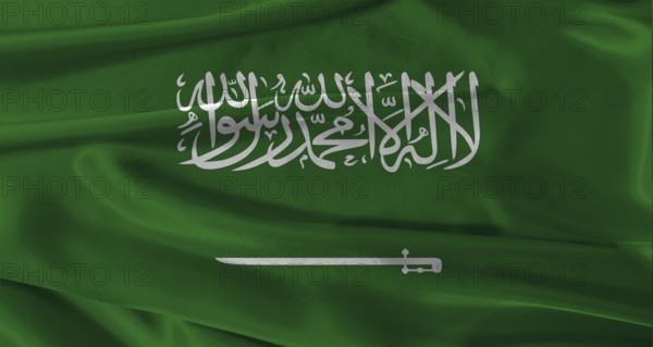 Flag of Saudi Arabia with fabric textured background. Close up of National flag of Saudi Arabia