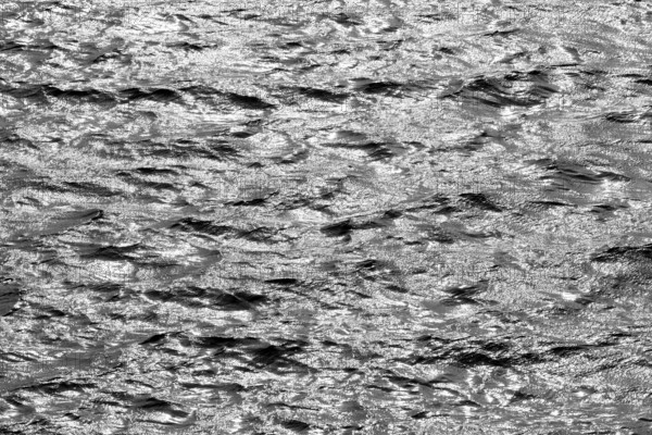 Water surface with waves and light reflections, black and white, Möhnesee, Möhnetalsperre, North