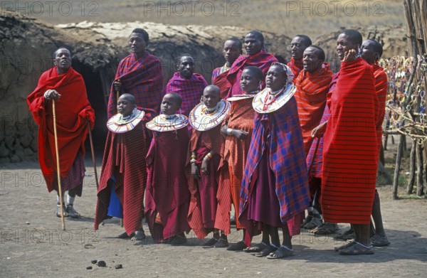 Maasai men and girls in their village in Ngorongoro Crater, Tanzania, Africa, June 2000, vintage,
