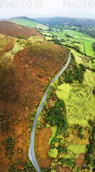 Autumn colours of Farms over River Wye and Road A470 from a drone, Llanidloes, Powys,