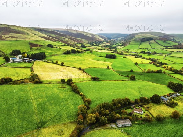 Autumn colours of Farms over River Wye and Road A470 from a drone, Llanidloes, Powys,